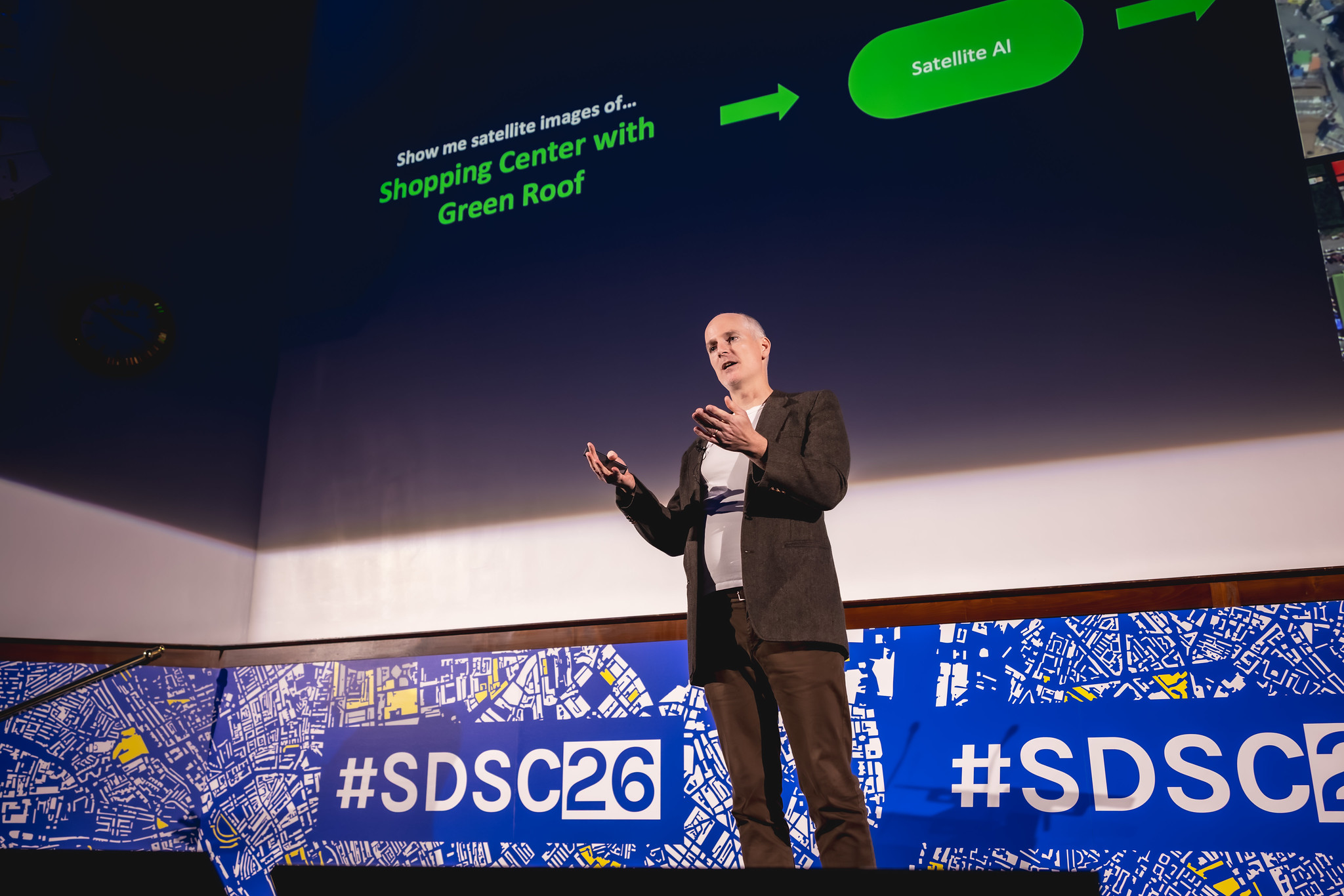 Conference stage with coordinated screen graphics and branded front panels